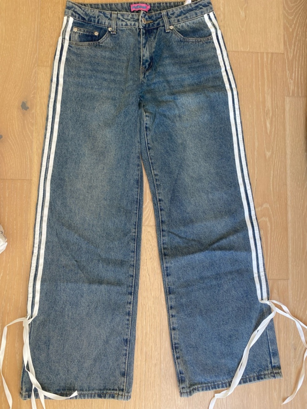 Edikted Blue Jeans with White Side Stripes and bows at bottom